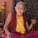 Nun, Bodhnath Stupa, Bodhnath, Kathmandu Valley, Nepal.