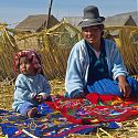 Uros woman & child, Floating Islands, Lake Titicaca, Peru.